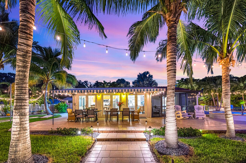 The backyard comes to life at night! Perfect for spending time in the pool, playing yard games, grilling out, or watching the big game!