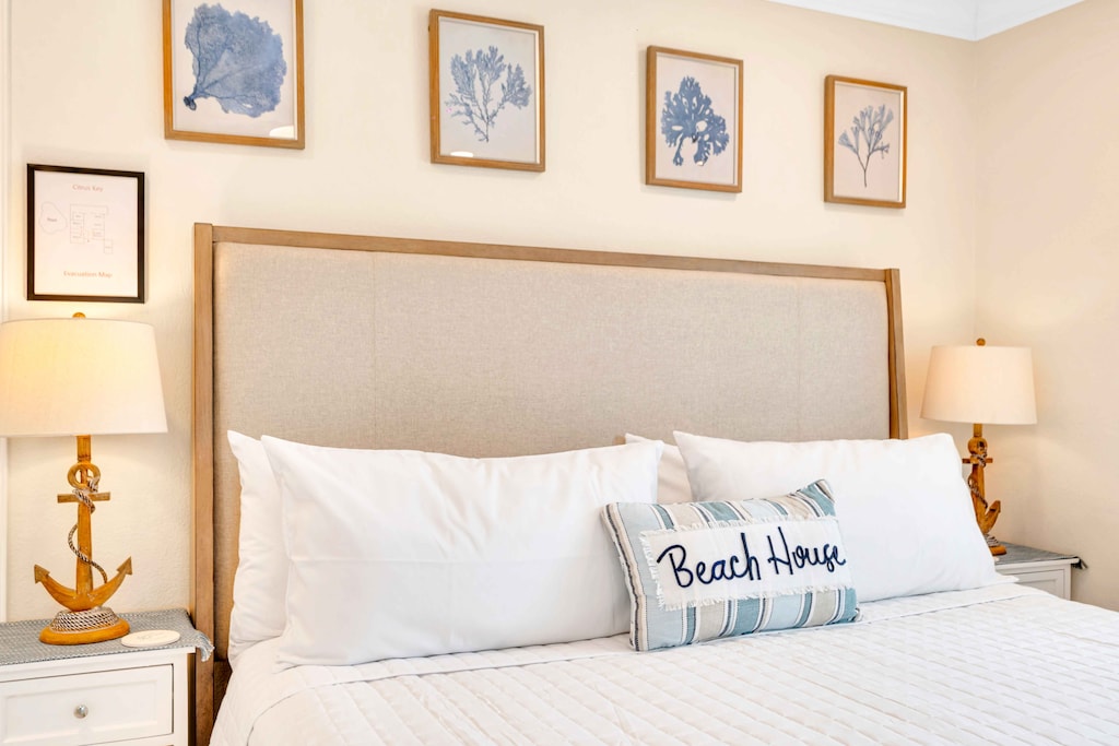 Bedroom 3 boasts a king bed and has direct access to the screened-in outdoor seating area. Perfect for sipping your morning coffee or enjoying the view of the pool and waterfront.