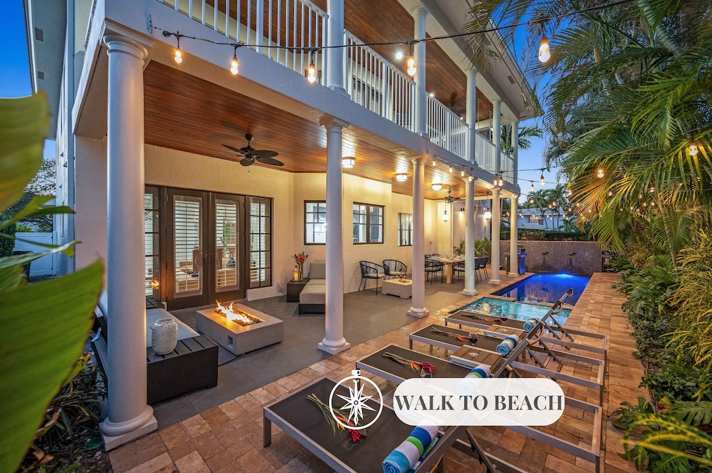 Quintessential Florida Keys style villa updated with modern fixtures, quaint breezy verandas, and towering ceilings. Unwind in the heated pool nestled in a tropical garden.