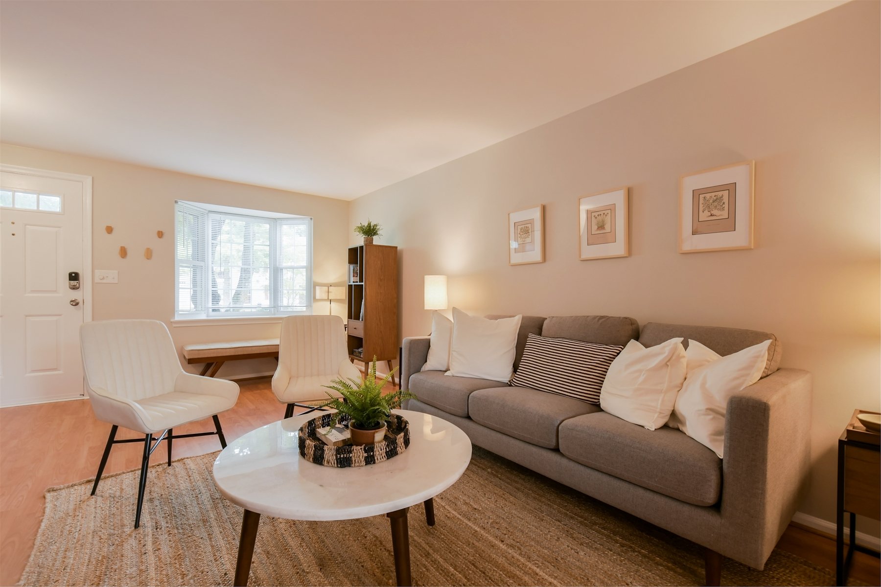 Ideal gathering space provided by a soft chenille sofa & accent chairs