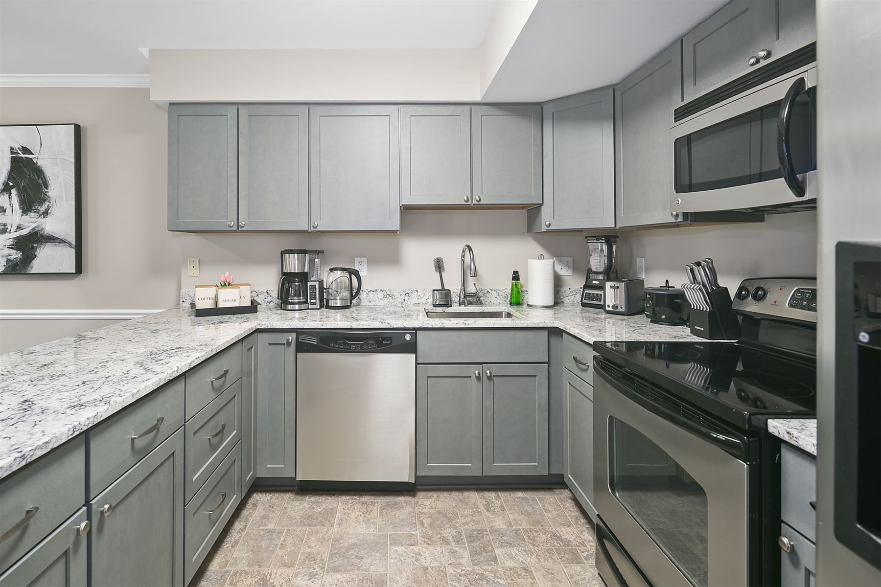 Grand kitchen equipped with cooking essentials & appliances