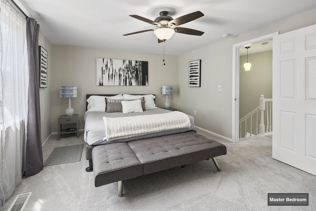 Master bedroom on second floor, w/ a king sized bed & end-of-bed bench -offers extra storage-