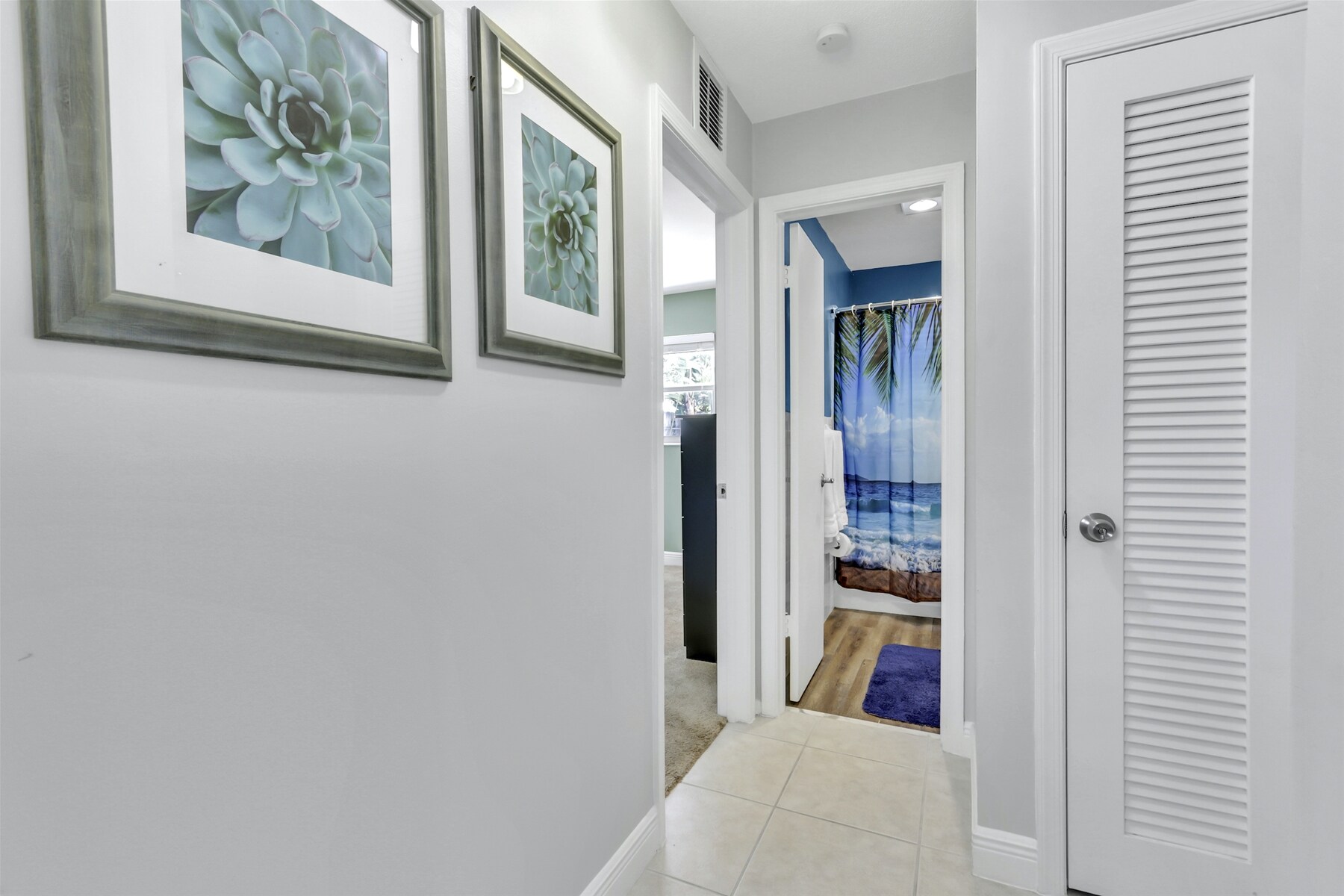 Hallway leading to third bedroom & hallway full-bathroom