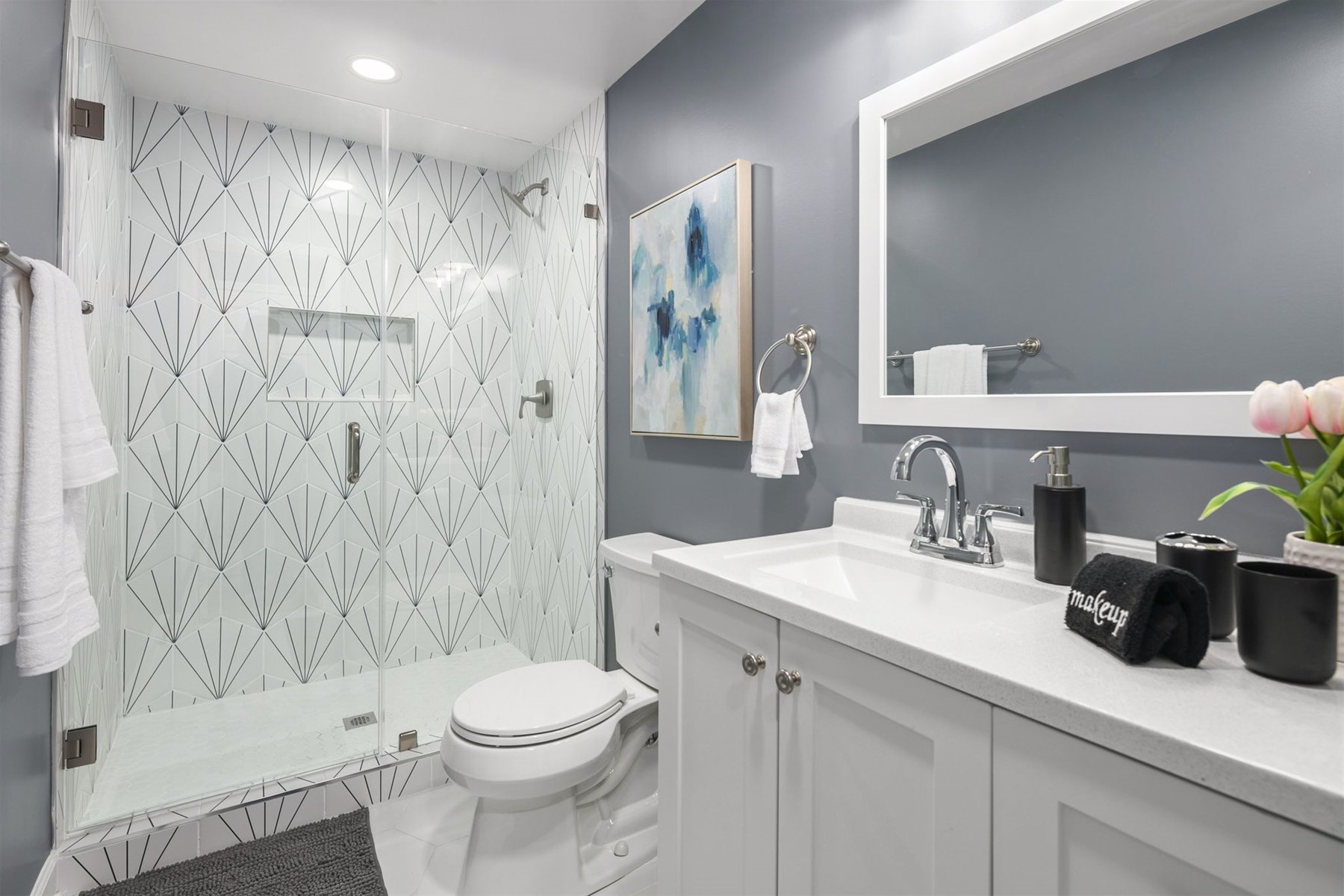 Stylish, basement full-bathroom, features a frameless shower