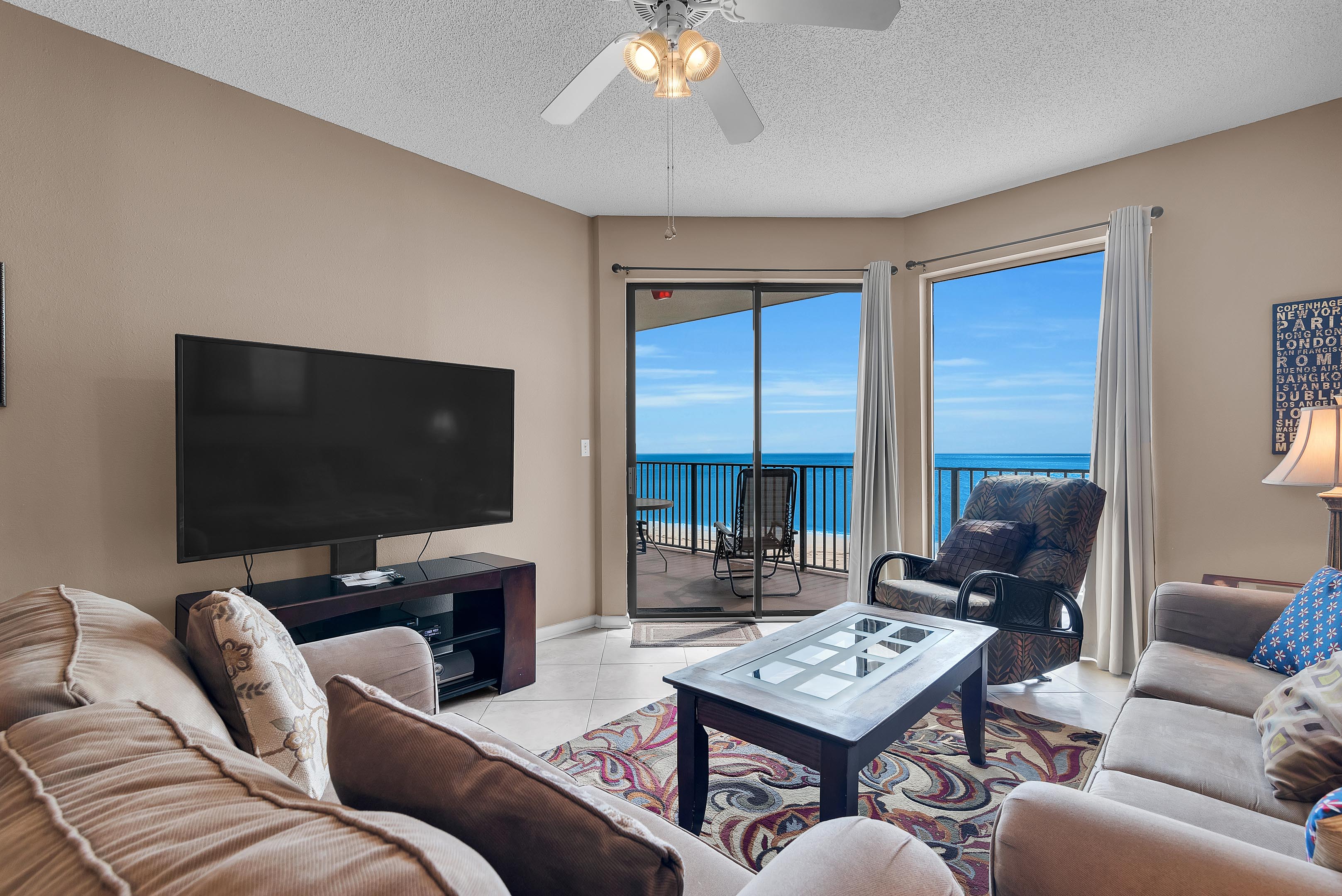 Living Room with Plenty of Comfortable Seating, Queen Size Sleeper Sofa, Flat Screen TV & DVD Player and Floor to Ceiling Views of the Gulf of Mexico