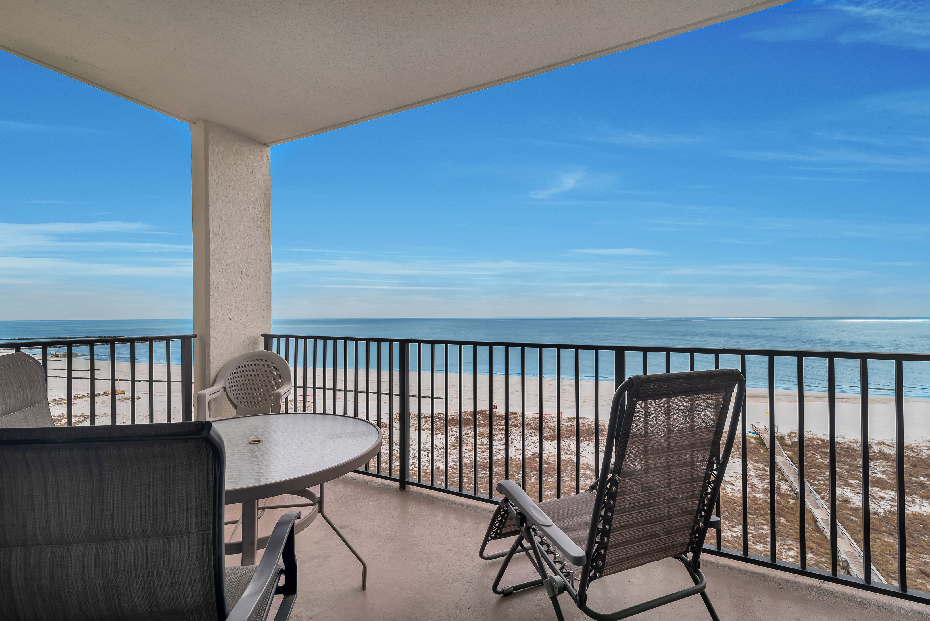 Private Balcony overlooking the Gulf of Mexico and Features Table for 4 & Chaise Lounger