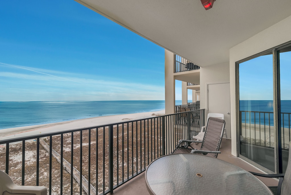 Private Balcony overlooking the Gulf of Mexico and Features Table for 4 & Chaise Lounger