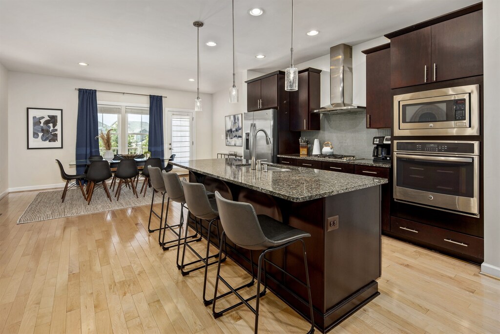 Kitchen island extends four counter stools