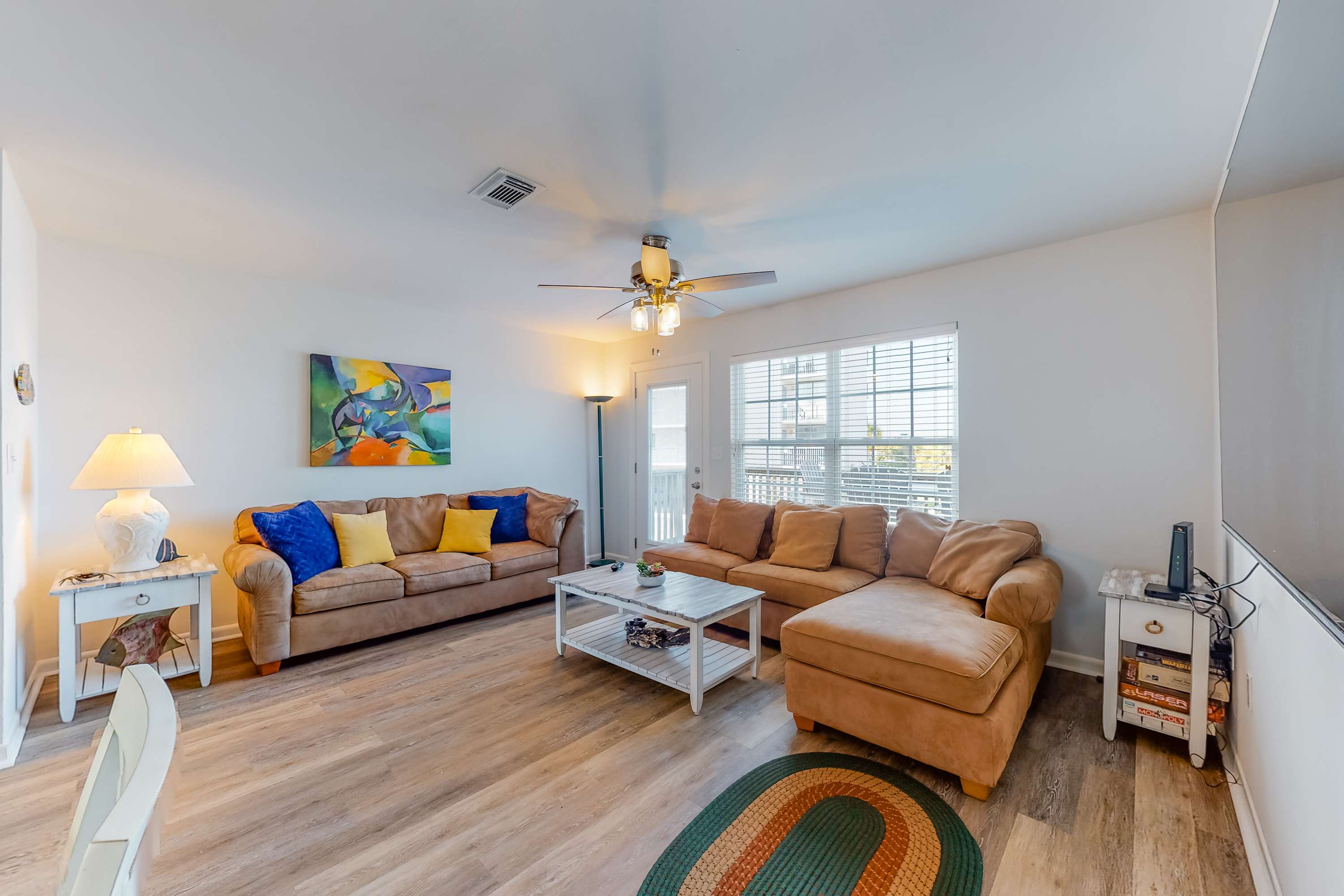 Modern waterfront condo with balcony & outdoor pool - beach across the street