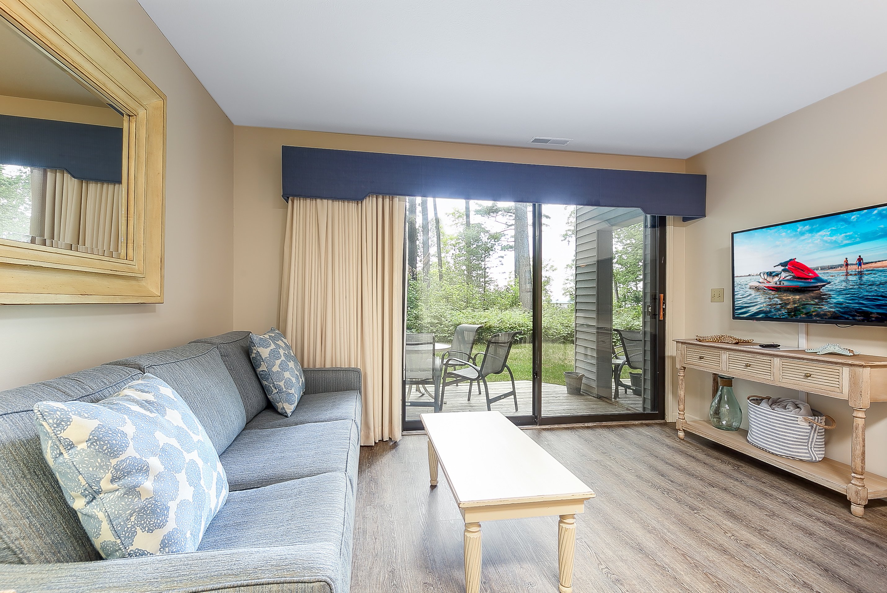 Beautifully lit living room - TV behind the camera with Cable & Wi-fi included.