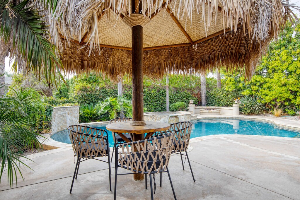 Outdoor dining table with umbrella.