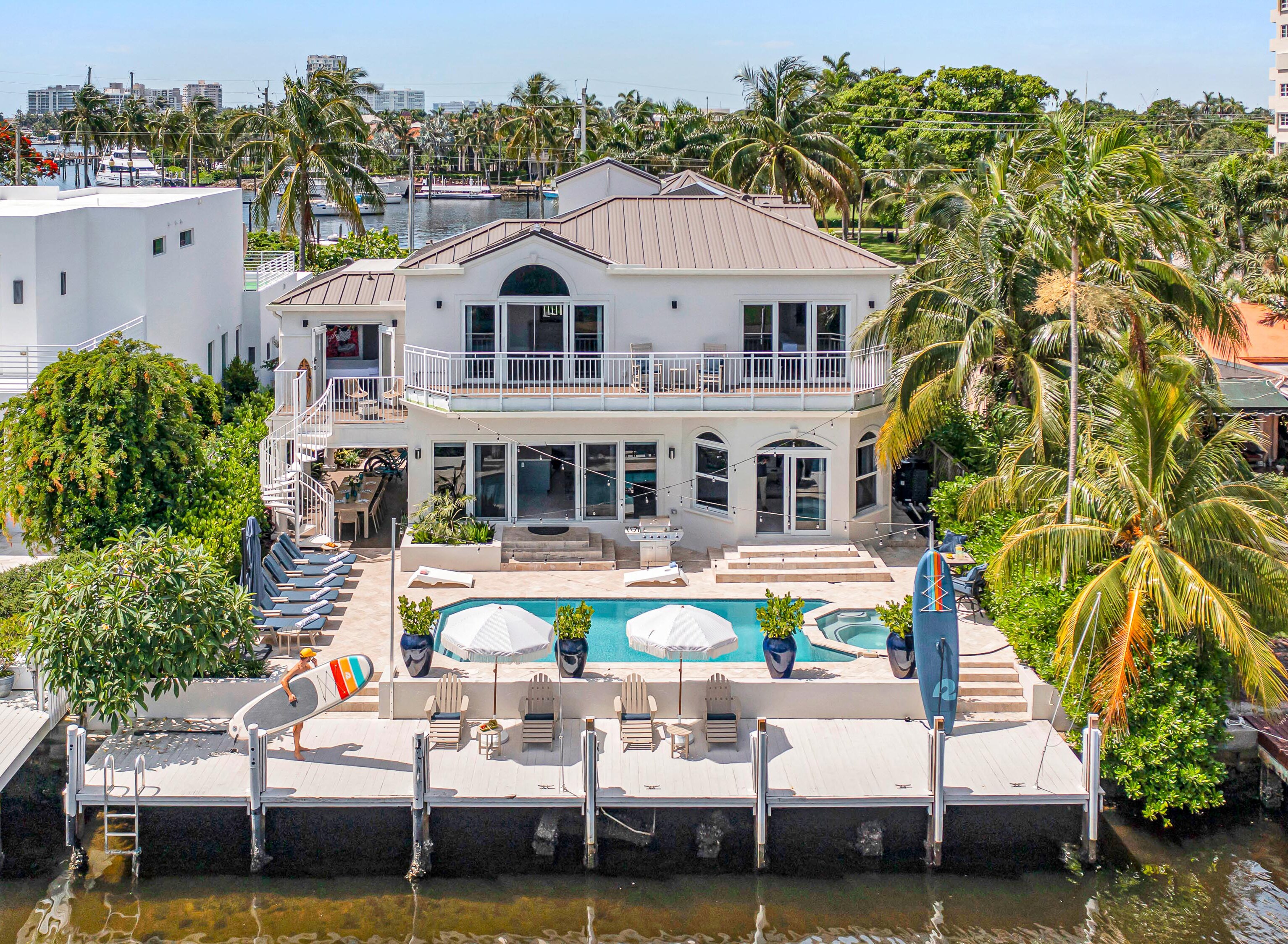 This modern coastal open floor plan villa offers waterfront views and access.