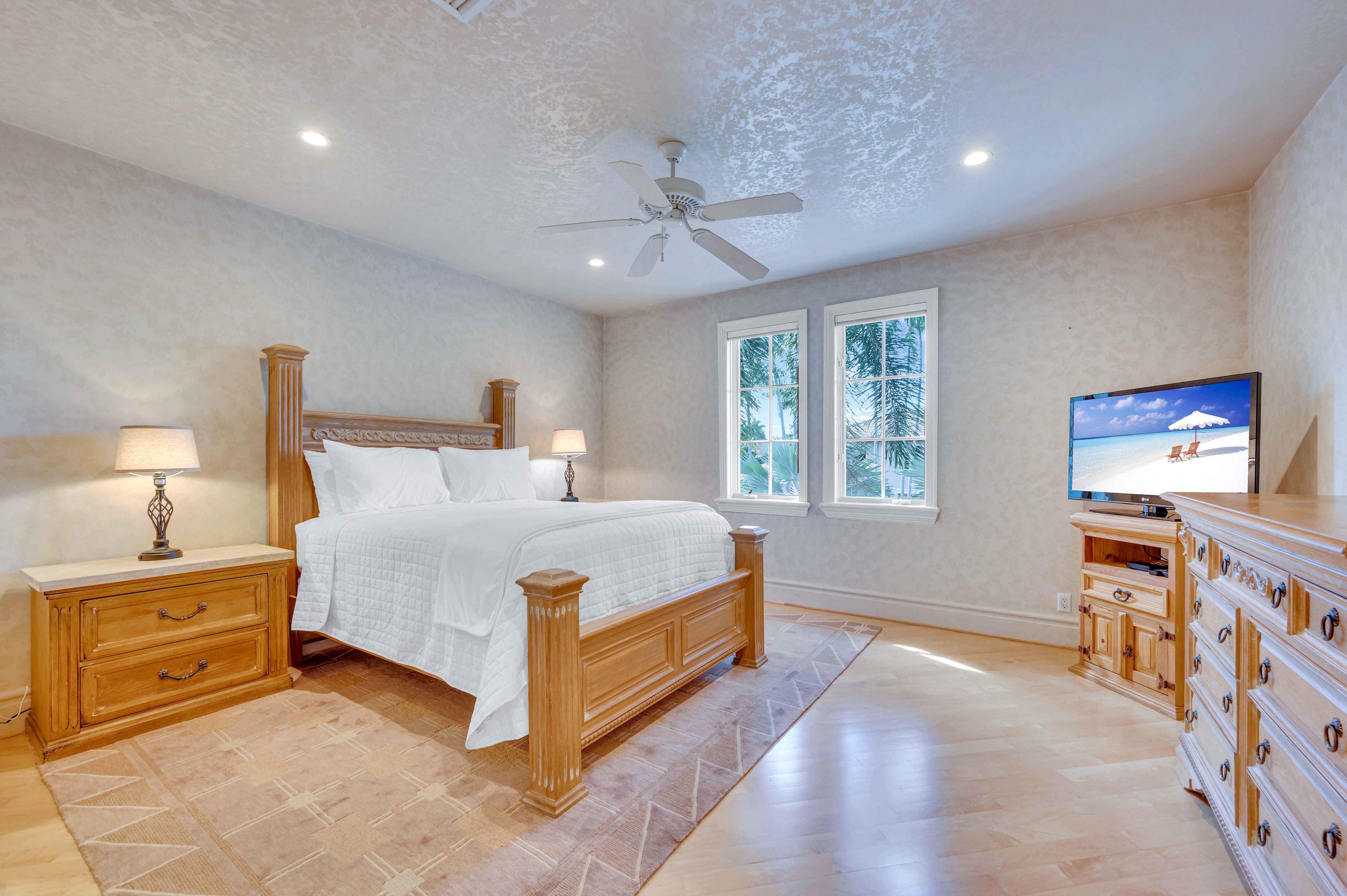 Bedroom 2 includes a queen bed, smart tv, ensuite bathroom, and a walk in closet. Bedroom 2 includes a queen bed, smart tv, ensuite bathroom, and a walk in closet.