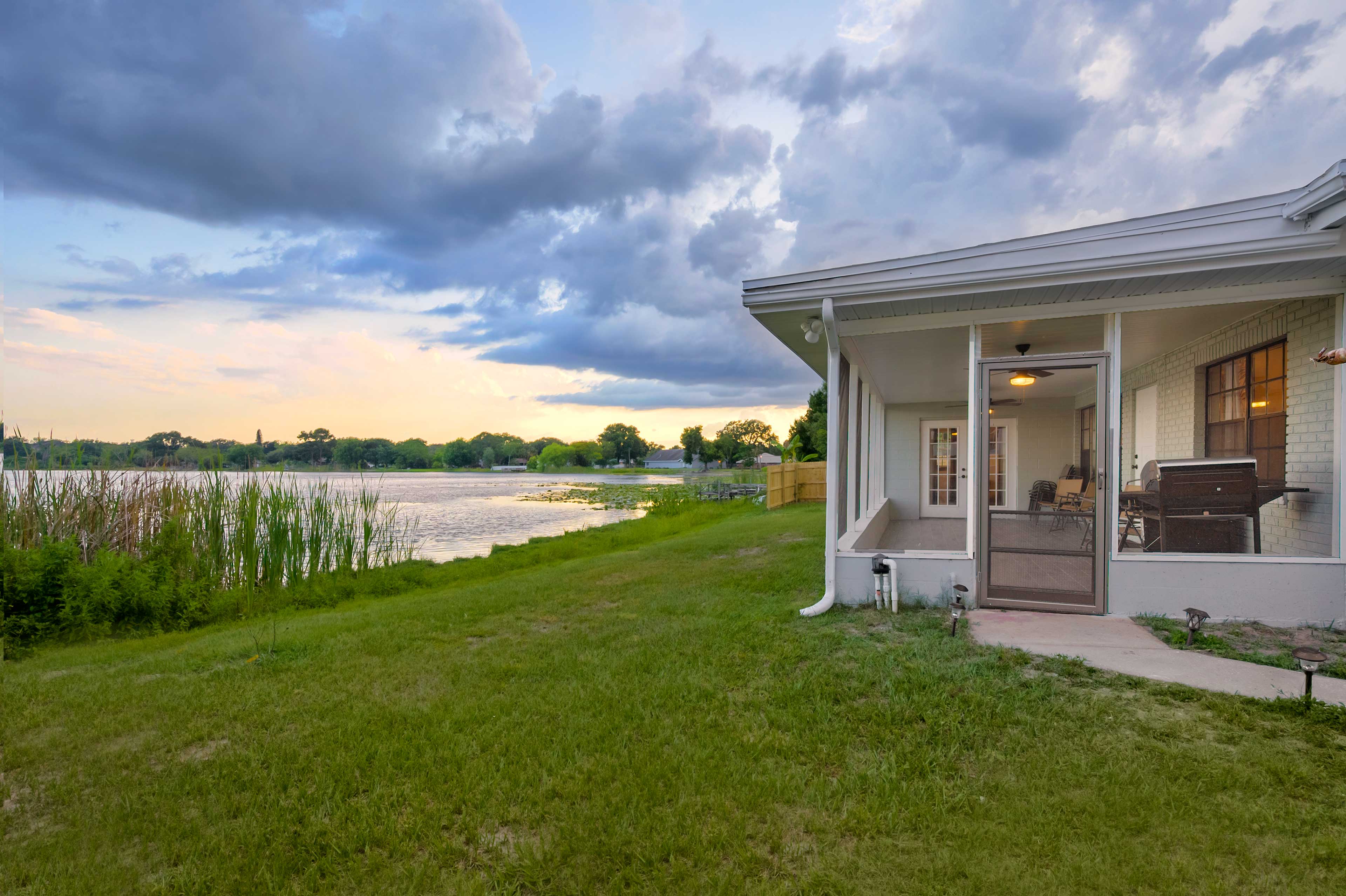 Property Image 1 - Lakefront Home w/ Screened Porch & Grill