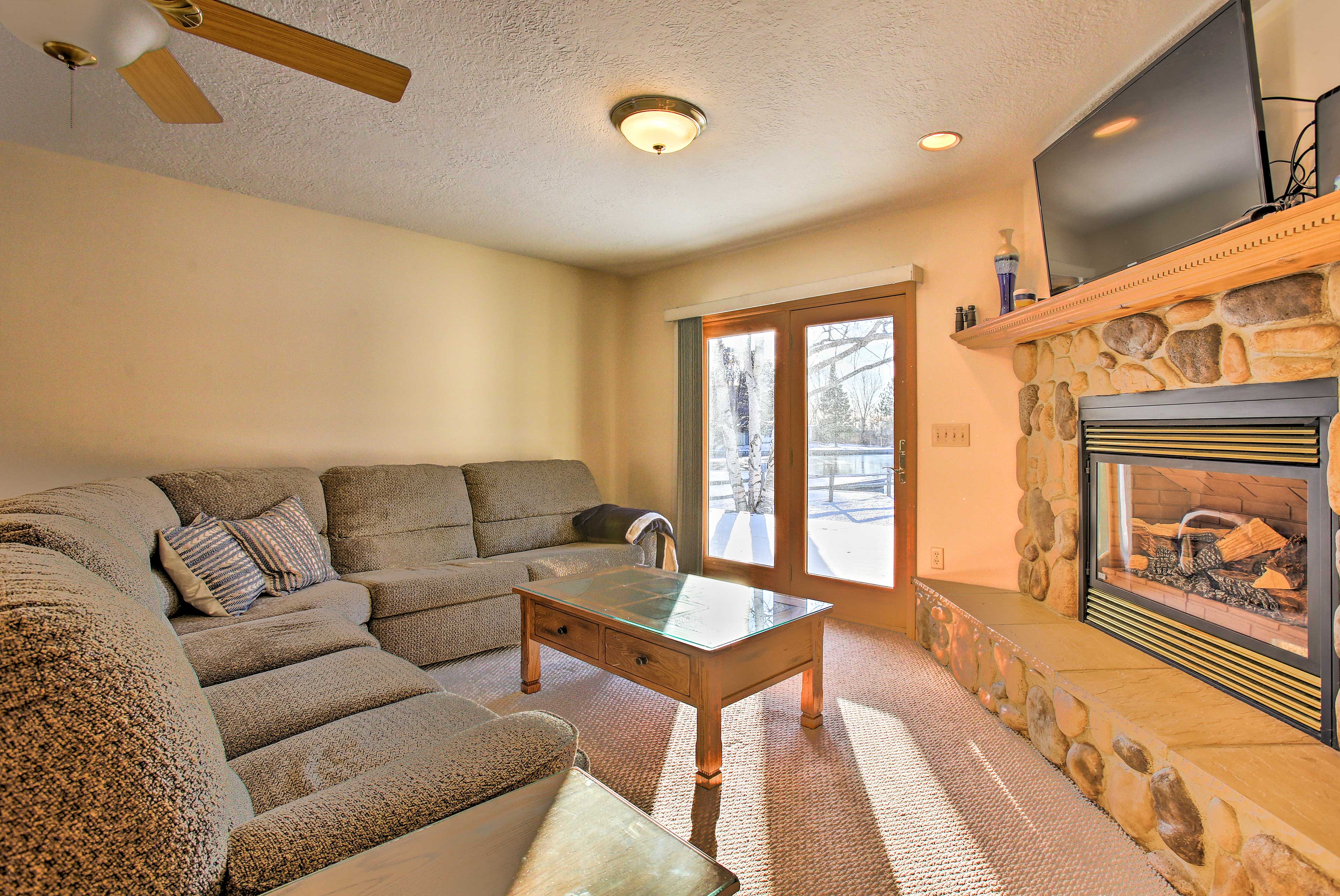 Property Image 1 - Cozy Riverfront Home w/ Fire Pit in Houghton Lake!