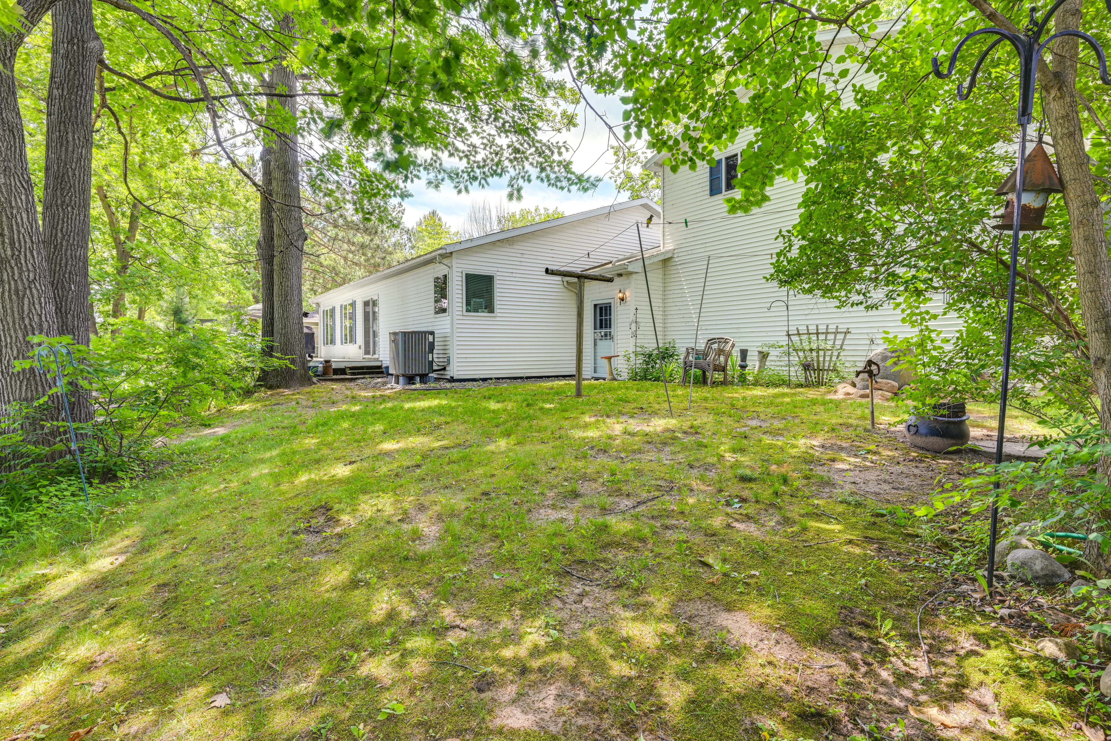 Property Image 1 - Waterfront Gladwin Home w/ Deck + Fire Pit!