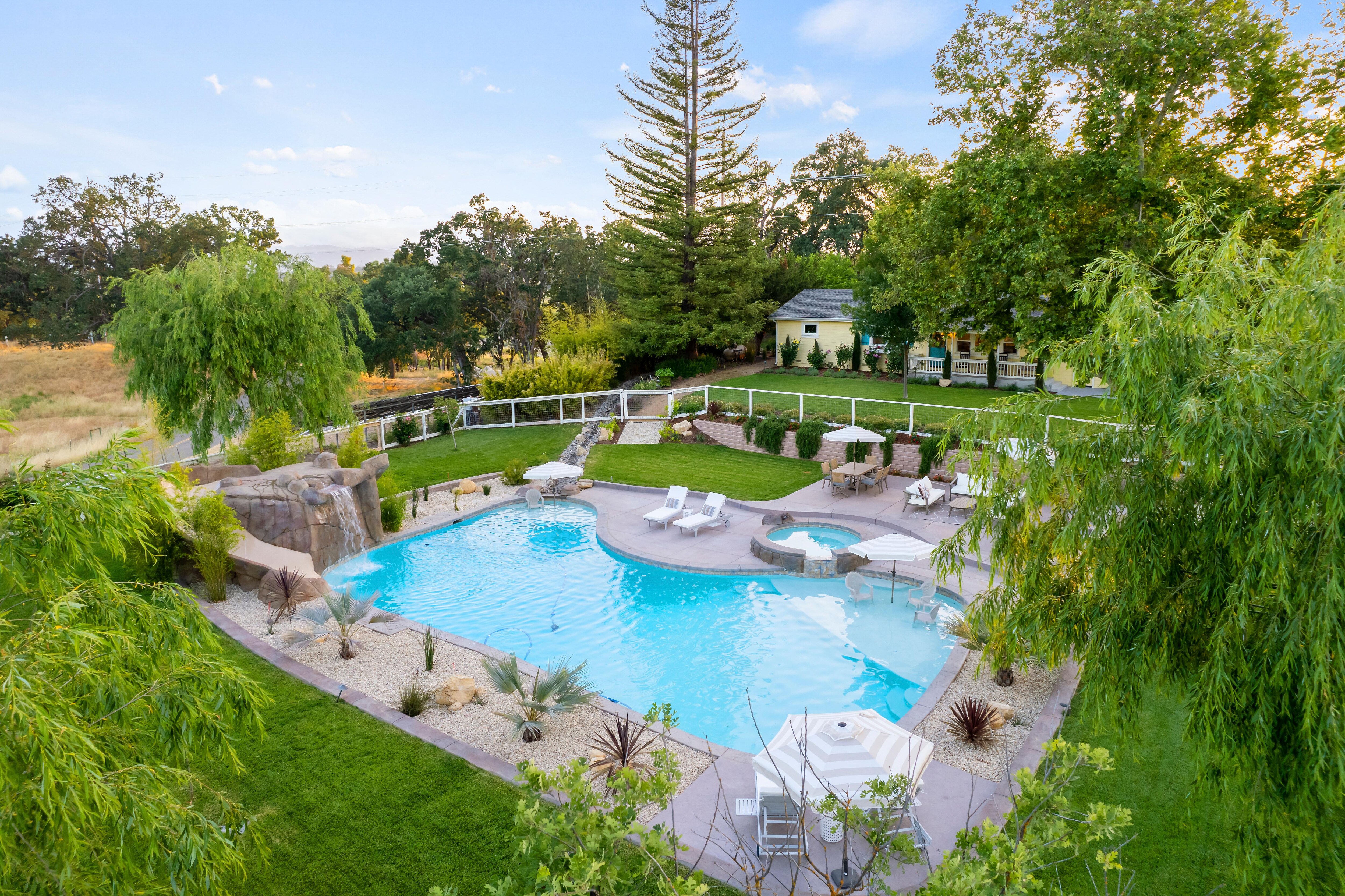 Excellent outdoor space with pool, spa, and waterfall slide