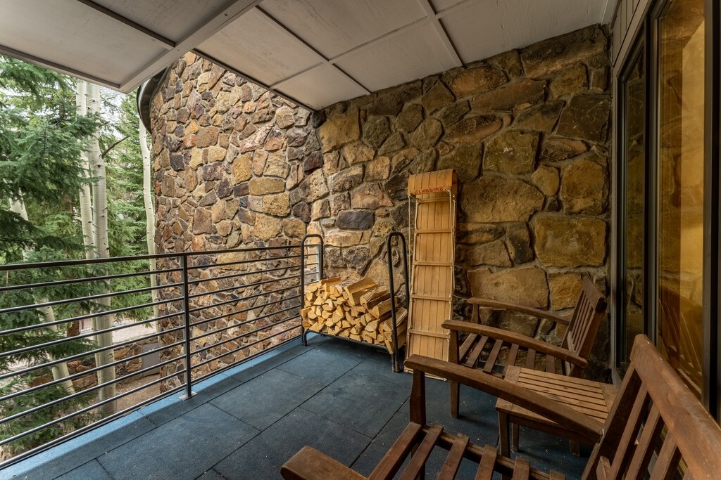 Private Patio offering courtyard and mature pine tree views.