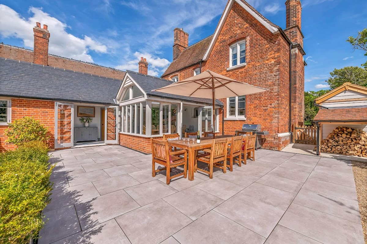 Patio area with outdoor dining table & BBQ