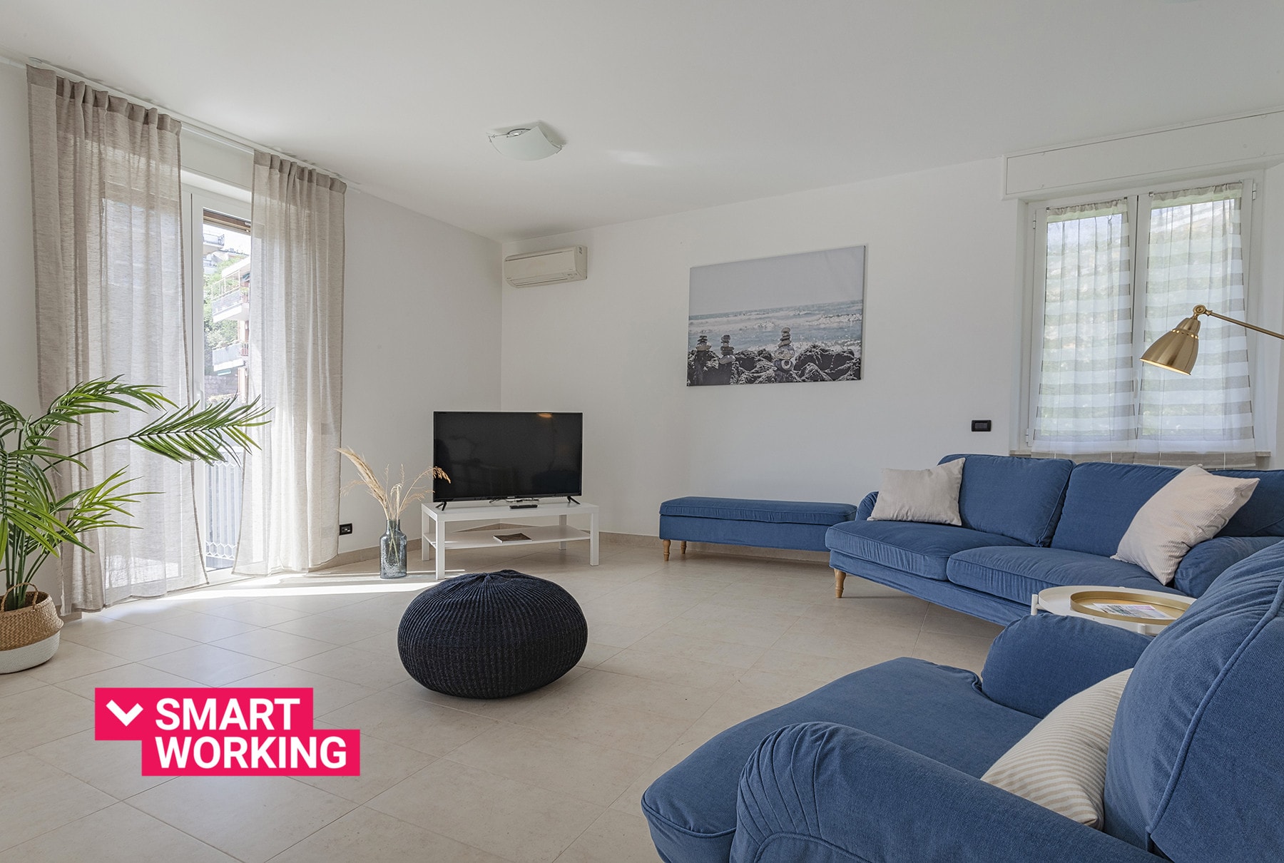 Property Image 1 - White and Blue Apartment with Balcony