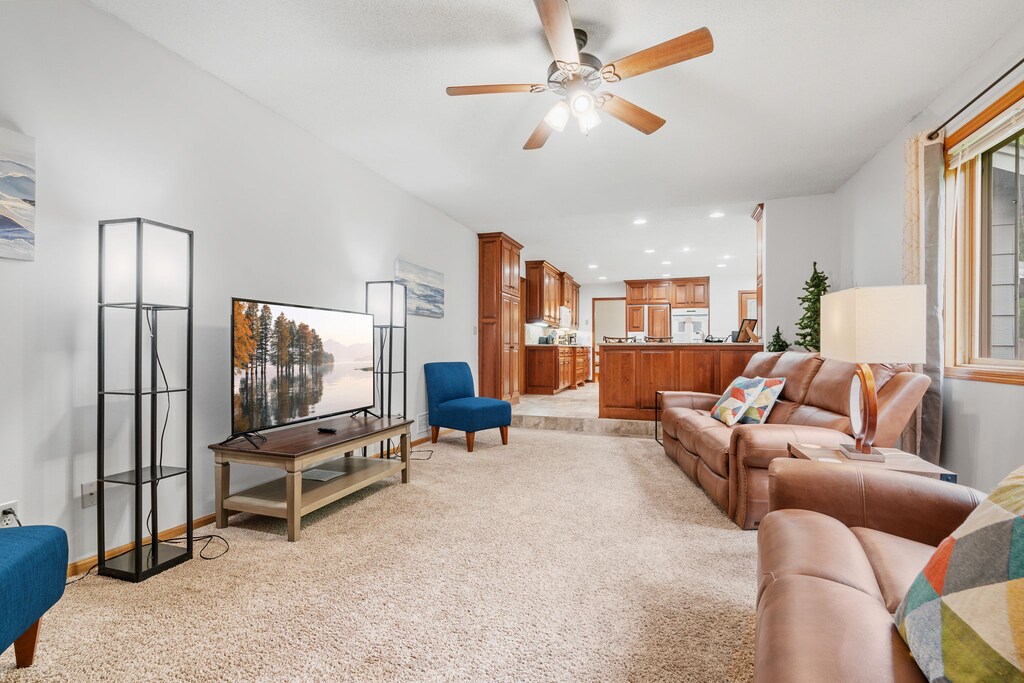 Sink into plush leather seating while your favorite shows play on the large TV in this inviting living space.
