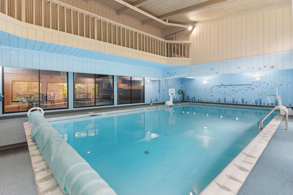 Dive into crystal-clear waters in your private indoor pool, where marine-themed murals create an underwater paradise for endless relaxation.