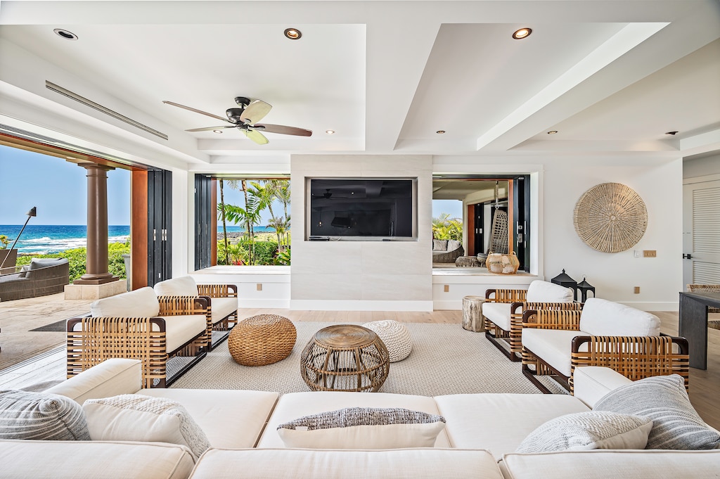 Relax in the comfort of white couches and big tv