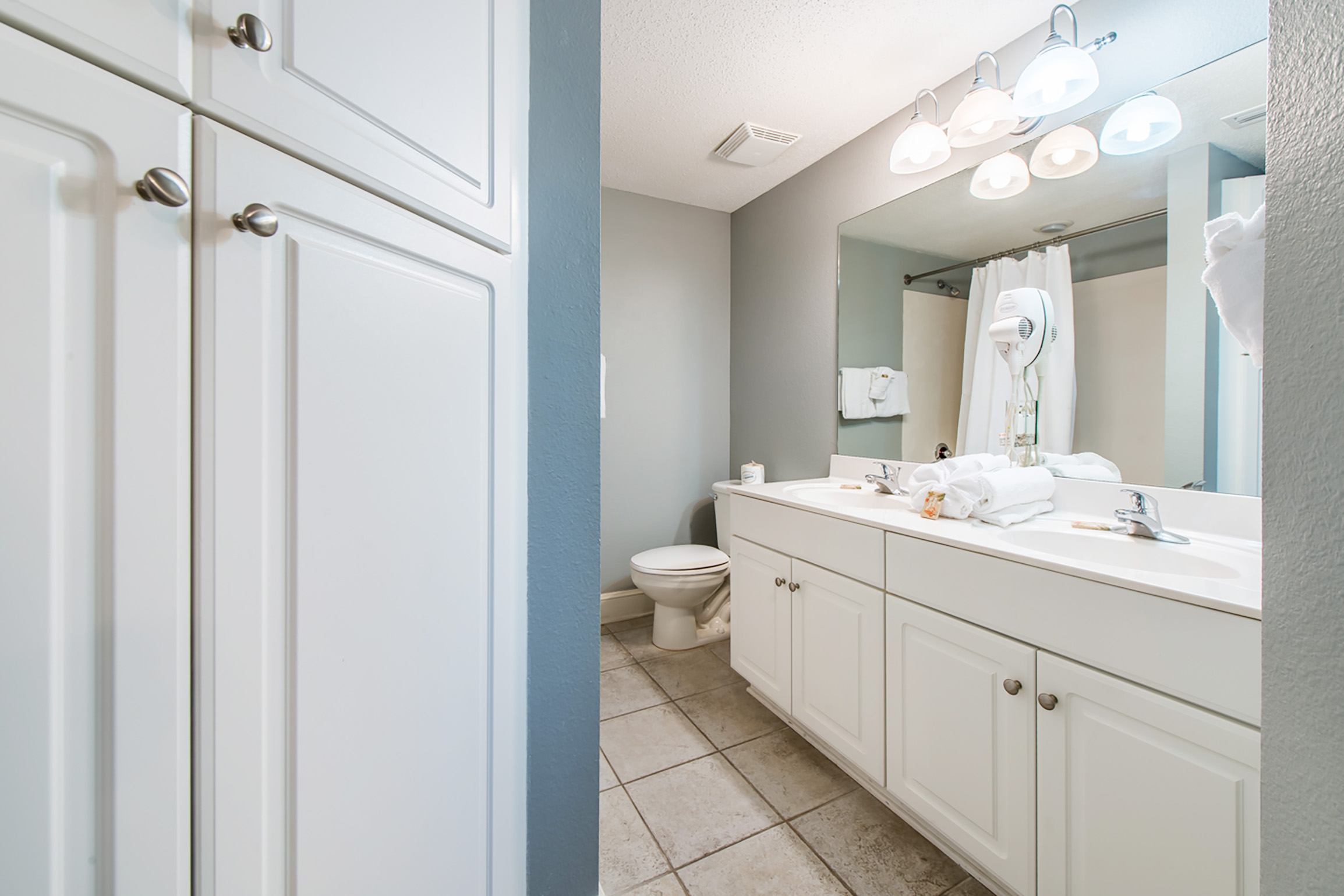 Dual sinks in full bath with tub shower combo