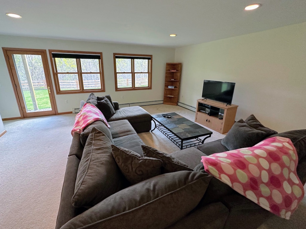 Lower level living area with sectional sofa and TV