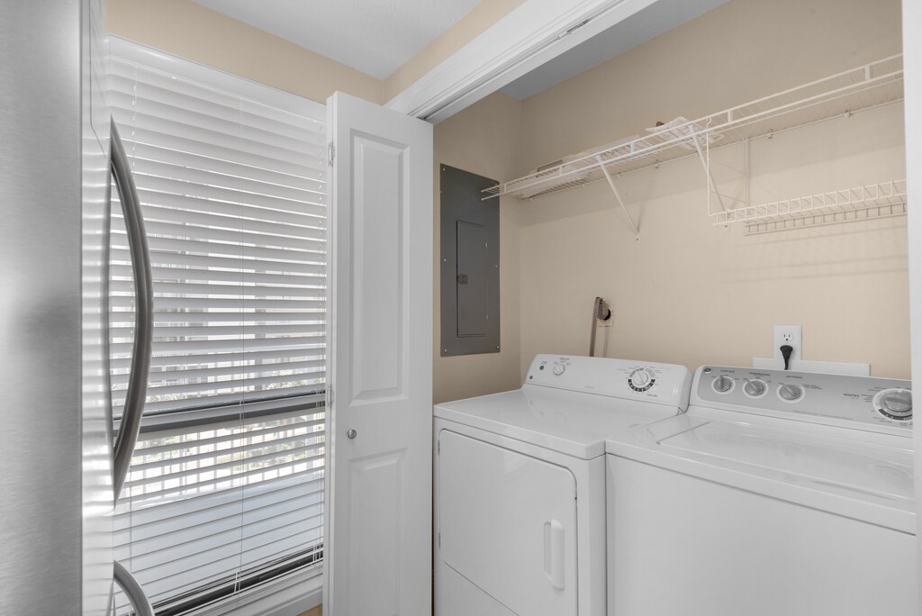 Washer and dryer across from refrigerator