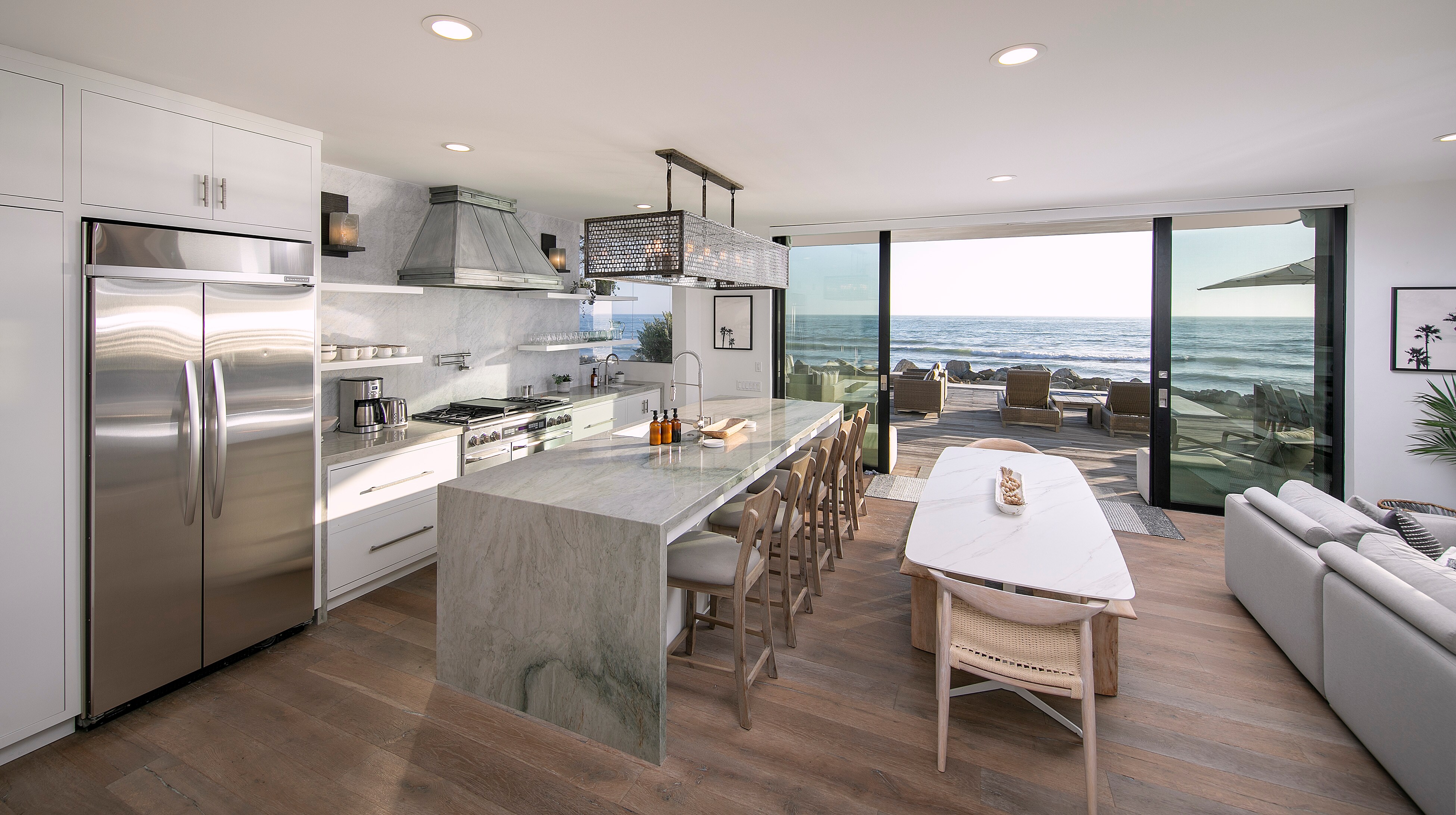 A pristine chef's kitchen offers the perfect space to create and enjoy meals together.