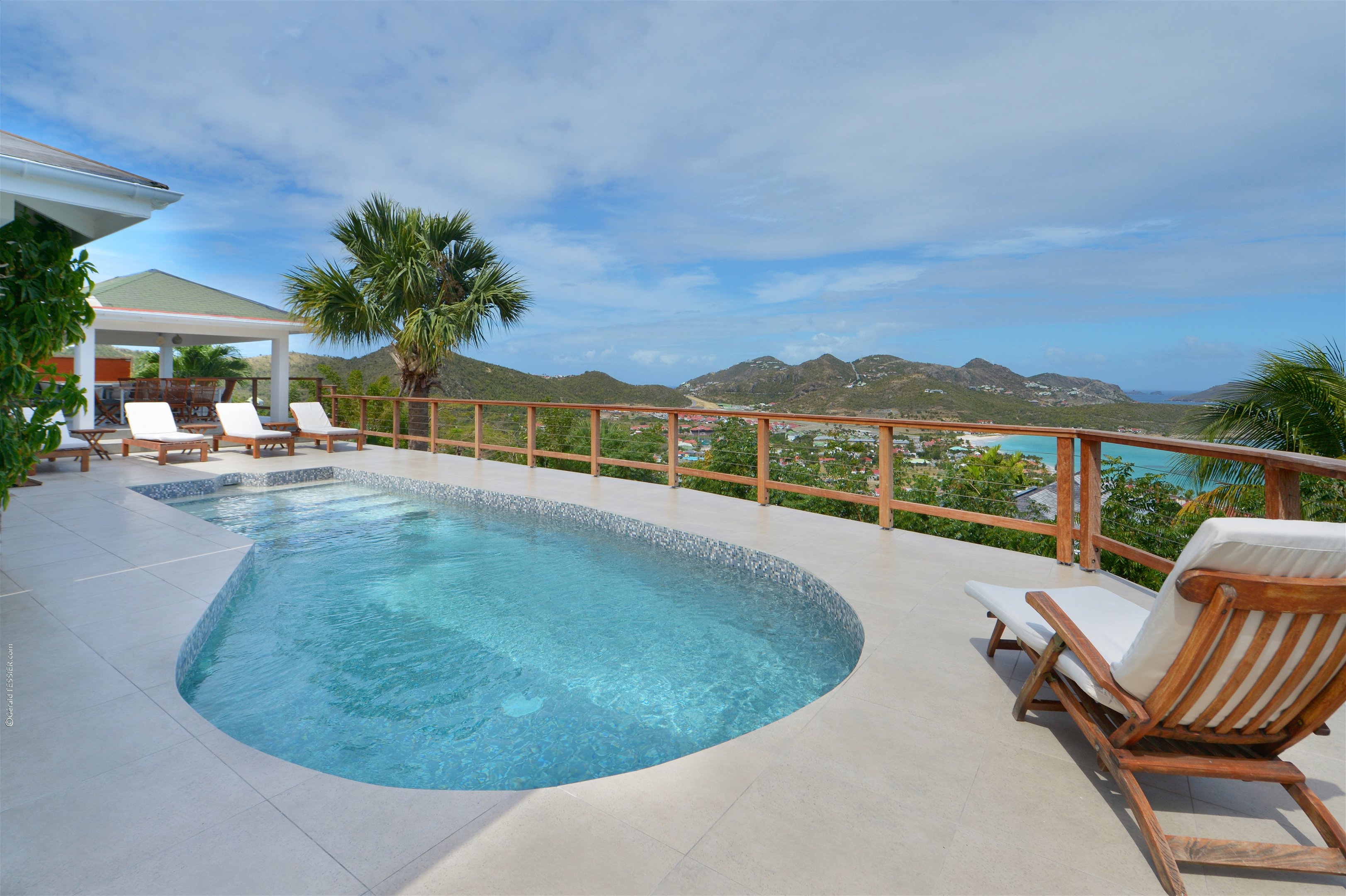 Beautiful pool, nice terrace with lounge area, deck chairs, and panoramic views over the bay. 