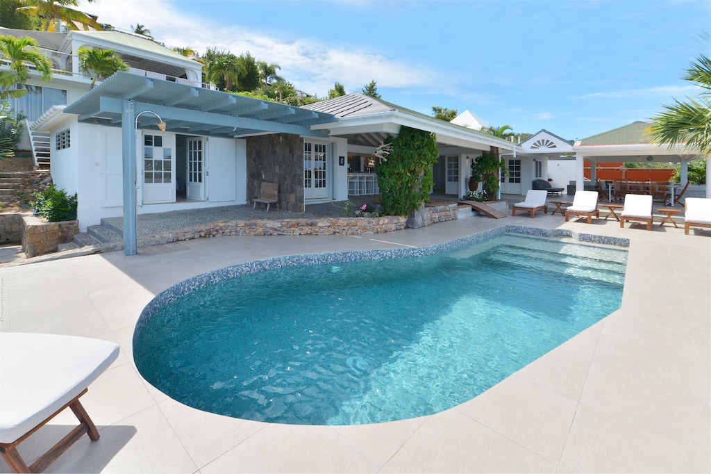 Beautiful pool, nice terrace with lounge area, deck chairs, and panoramic views over the bay. 