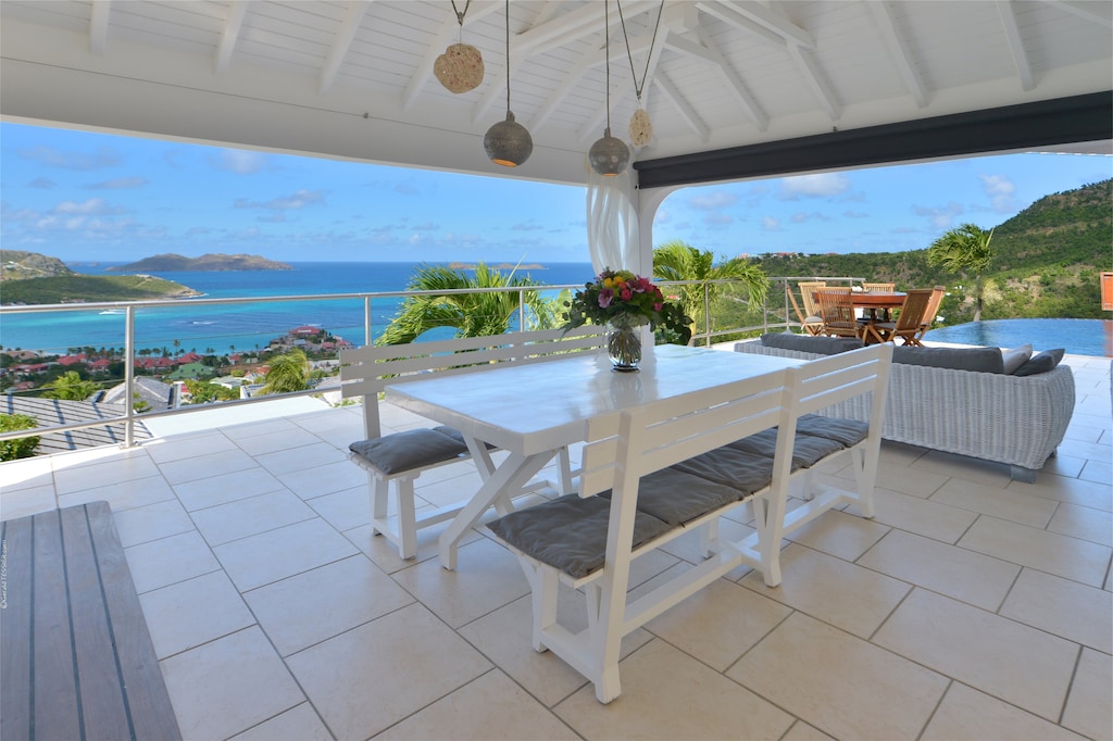 Fully equipped open-air, electric stove and oven, dishwasher, fridge and freezer, coffee and Nespresso machines, microwave, blender, kettle, fruit squeezer. Inside large white wooden table by the kitchen for up to 8 guests. Outside round teak table by the