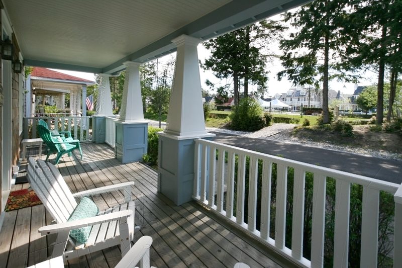 Covered front porch overlooks the park.