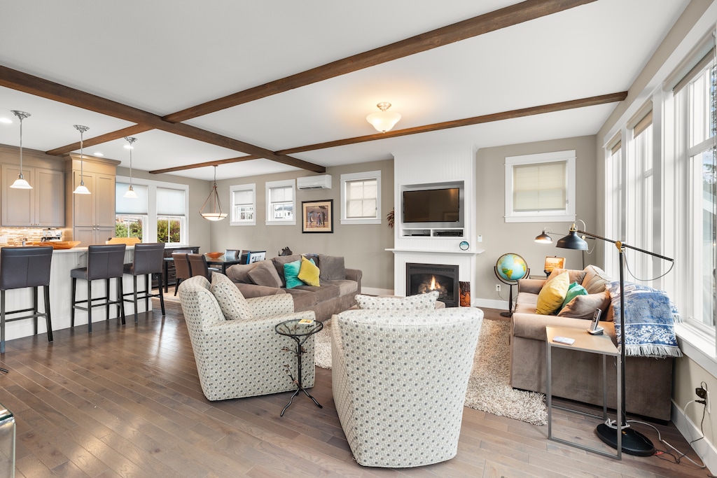 The living room has a queen sofa sleeper