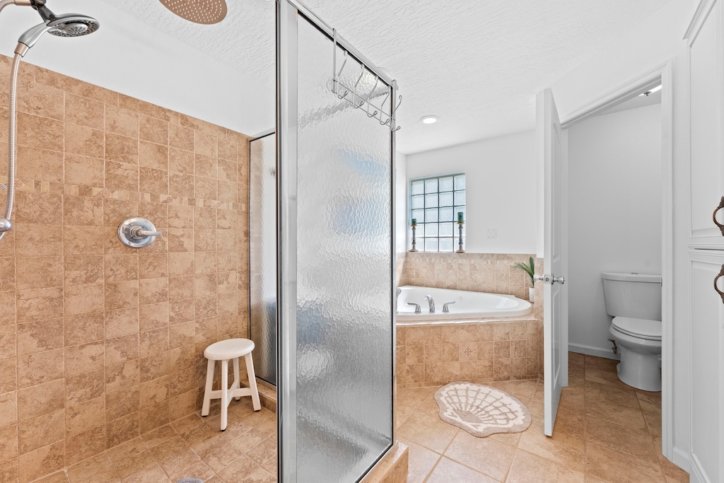Master bathroom with bathtub and step-in shower