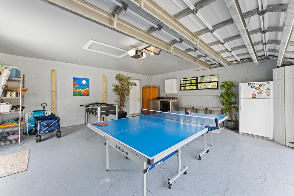 Game room in the garage with pingpong table and foosball
