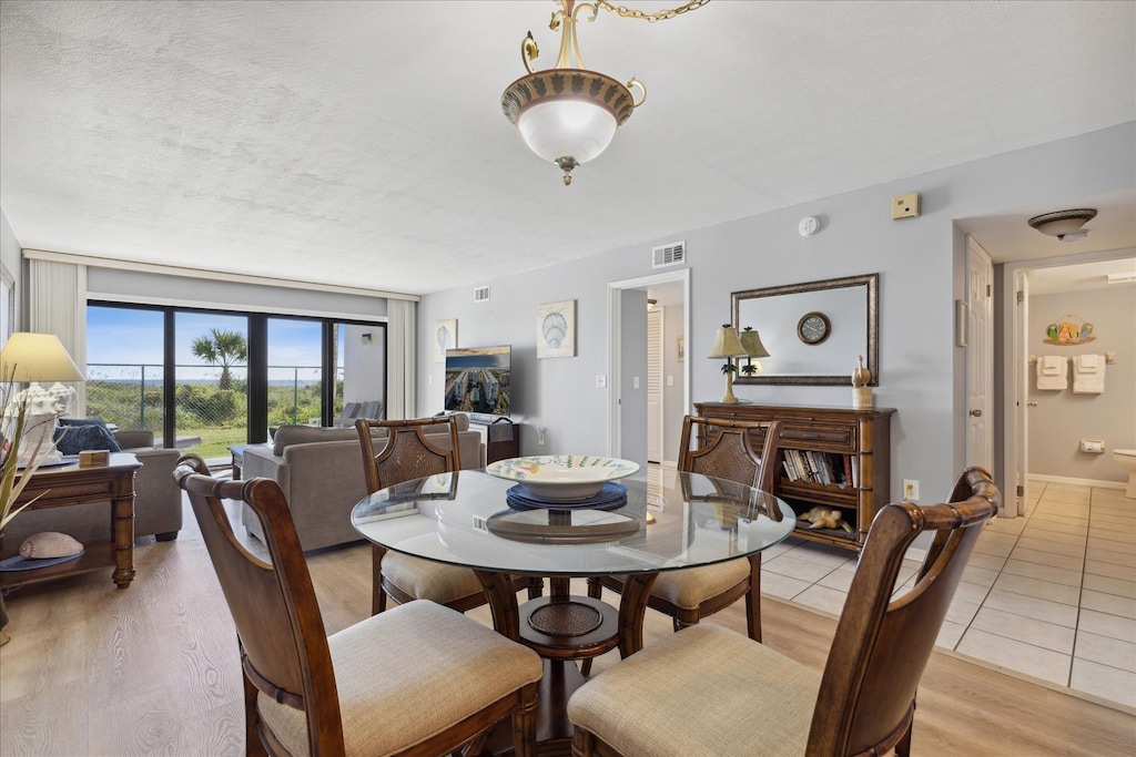 Gather the whole group in this open living space with plenty of comfy seating, sunlight pouring in, and easy flow from dining to beach-facing views.