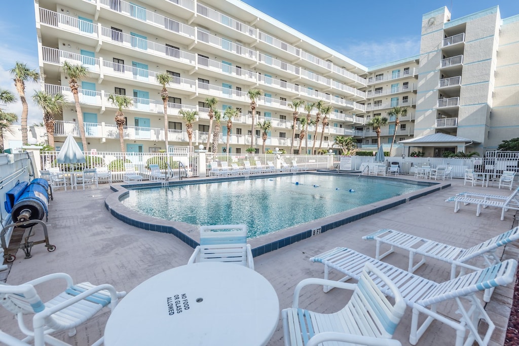 Cool off in the heated outdoor pool or unwind in the hot tub after a beach day. Lounge seating all around for full sun or shaded relaxation.