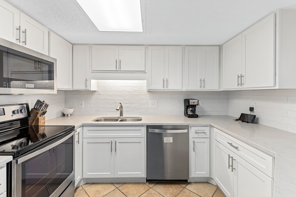 Beautifully Updated Kitchen with Stone Countertops and Stainless Steel Appliances