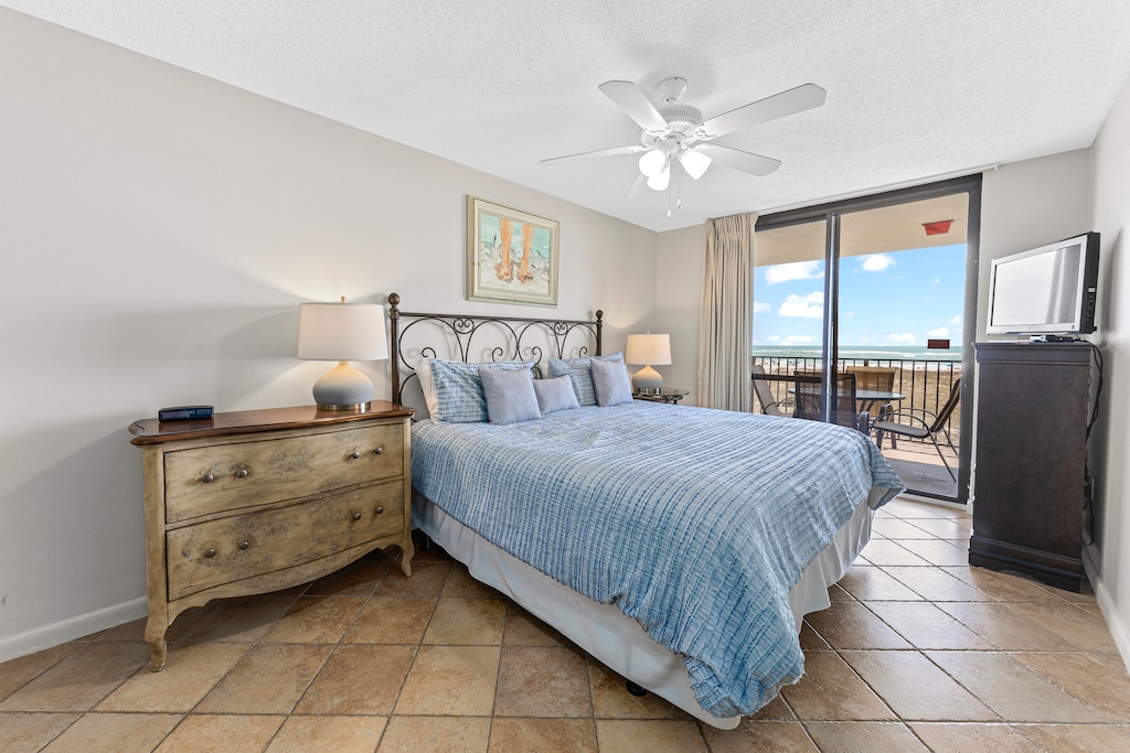 Master Bedroom with a King Size Bed and Private Balcony Access
