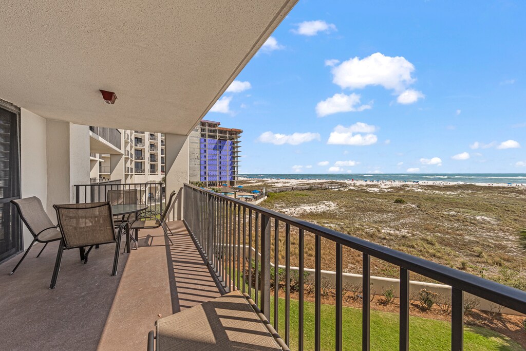 Private Covered Balcony Overlooking the Gulf and Seating for Outdoor Dining