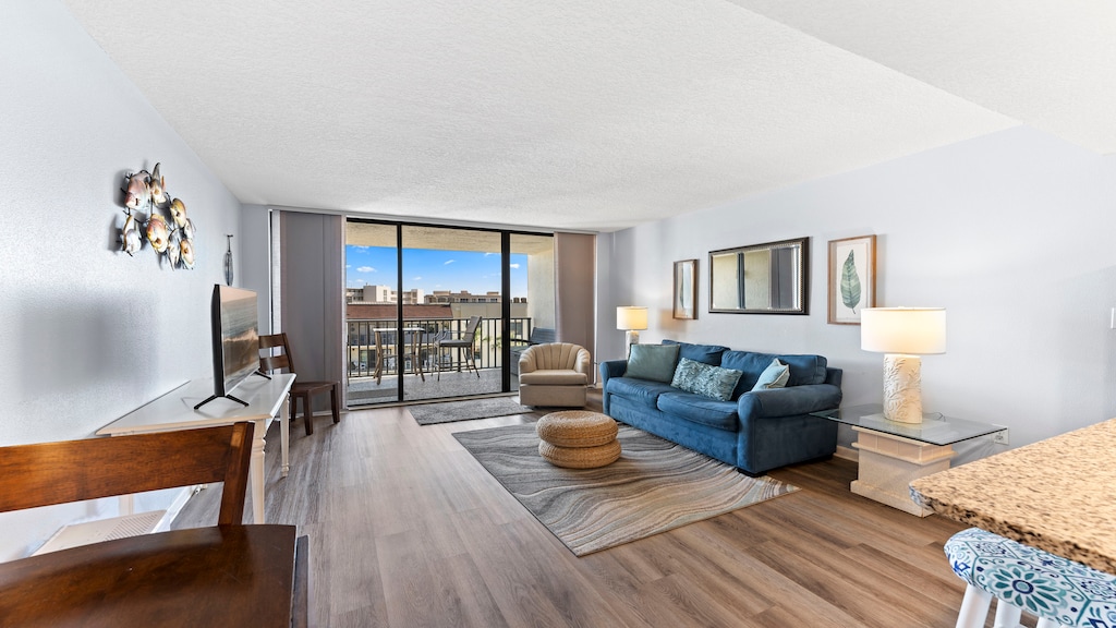 Feel the ocean breeze as you sink into the cozy sofa, sip your morning coffee, or unwind with a movie after a beach day