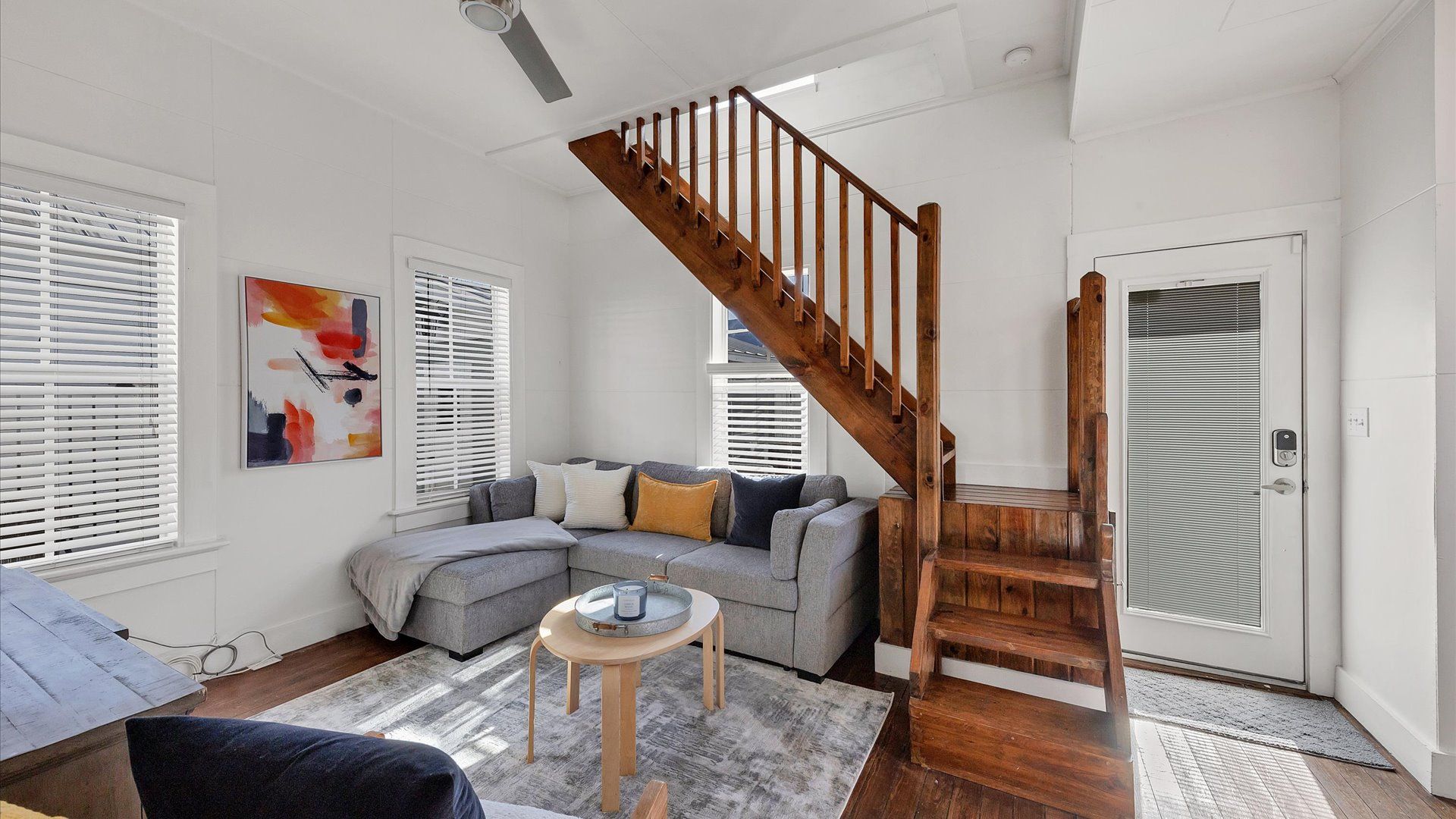 Bright and open living room- the couch folds out into a sleeper sofa