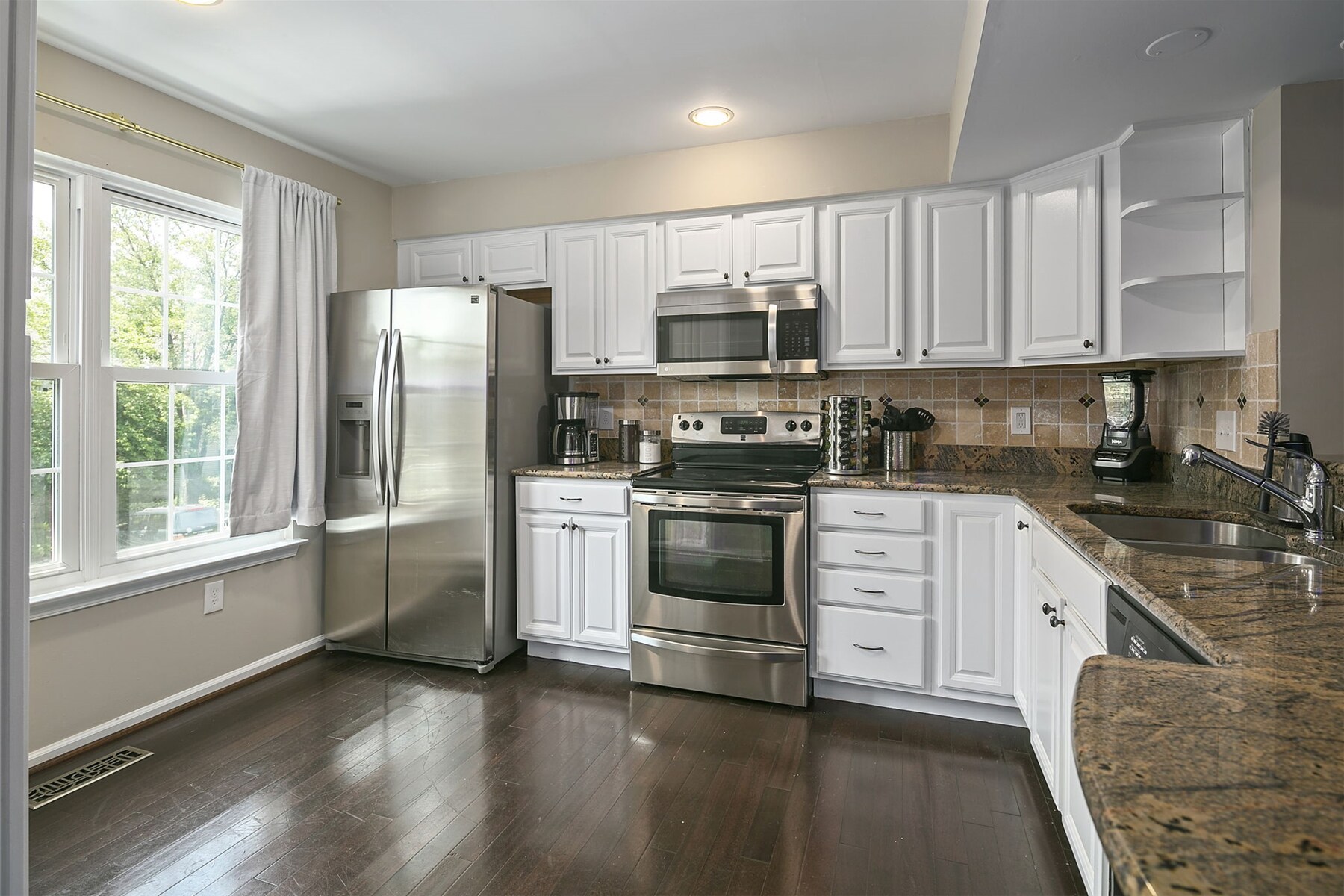 Spacious kitchen offers functionality with extra cooking room