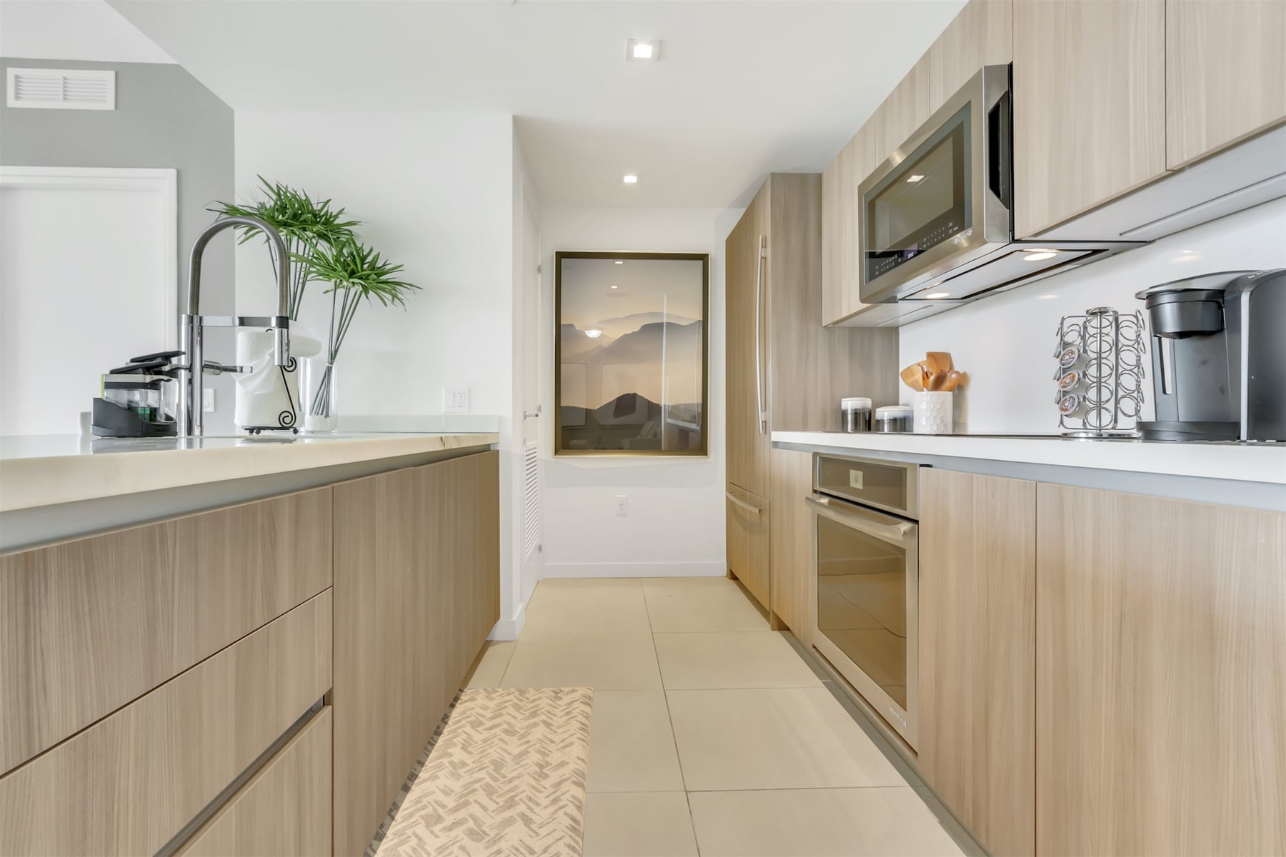 Modern kitchen features a built-in fridge