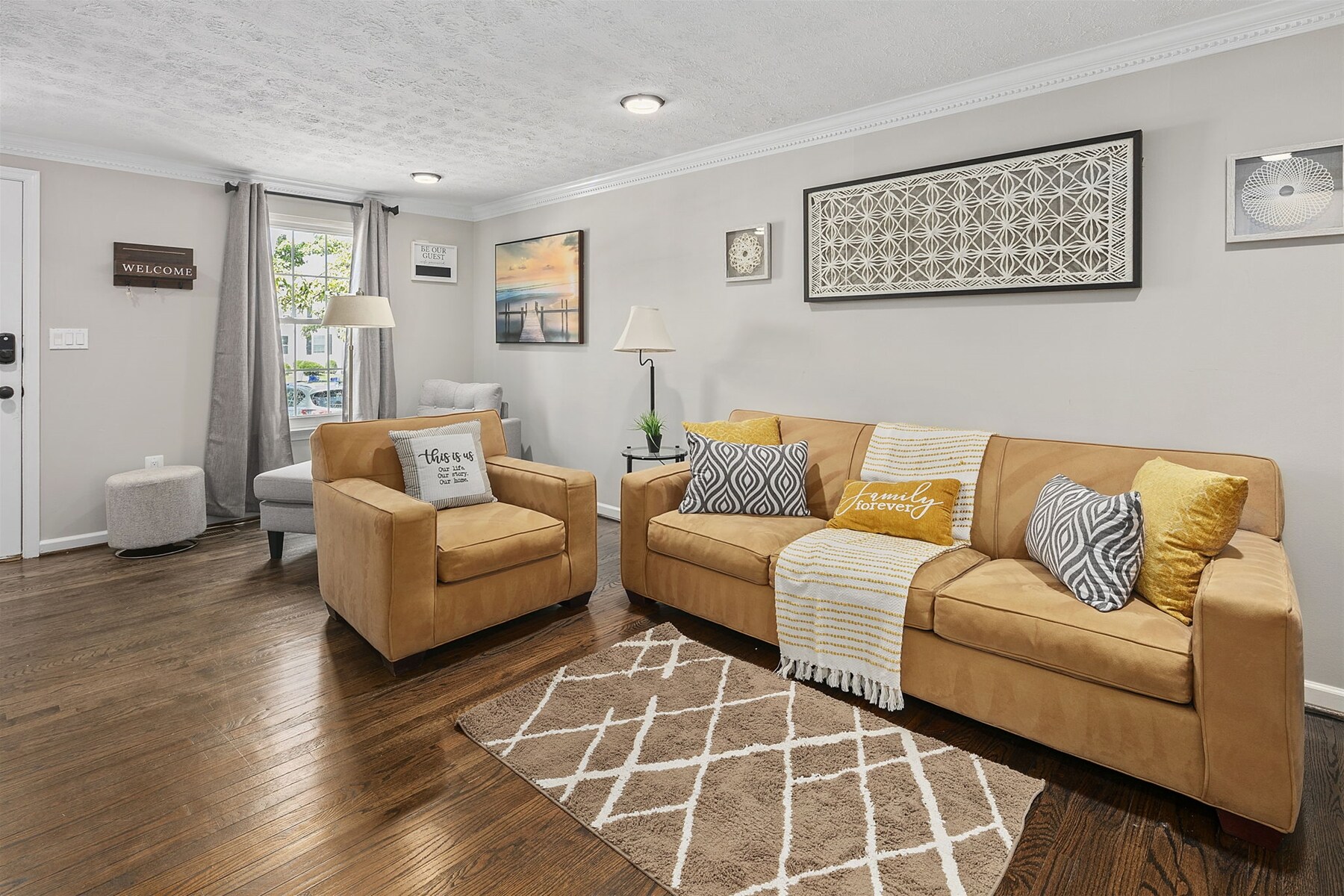 Spacious living room extends a wide sofa & accent chairs