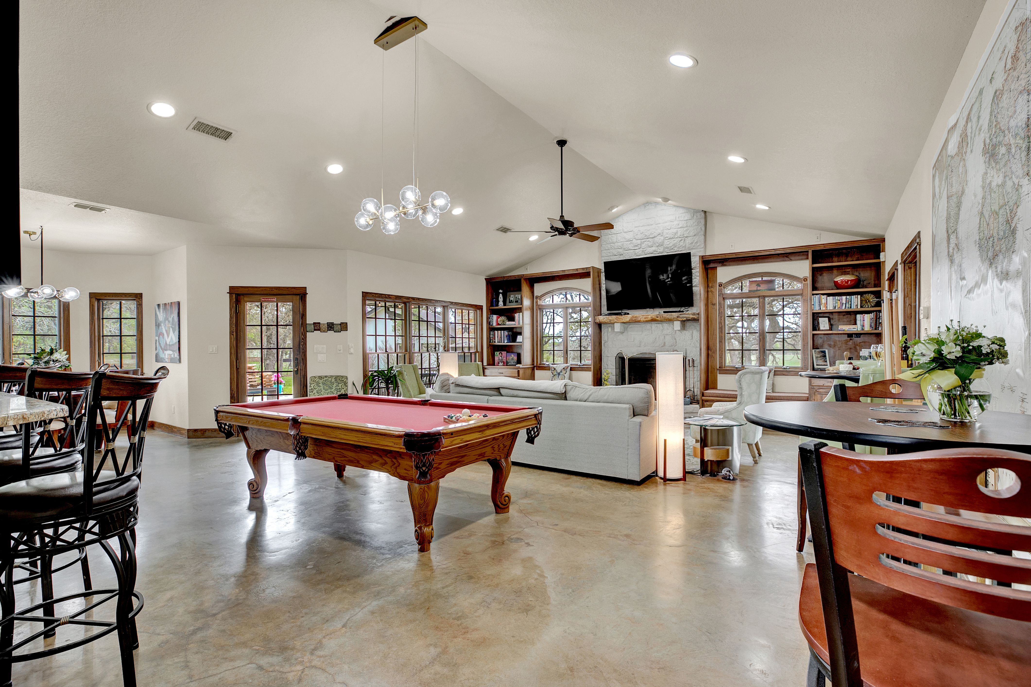 Make amazing memories in this stunning large living room with pool table and big screen TV! Perfect for friend and families to get together and unwind after a long day of exploring Fredericksburg!