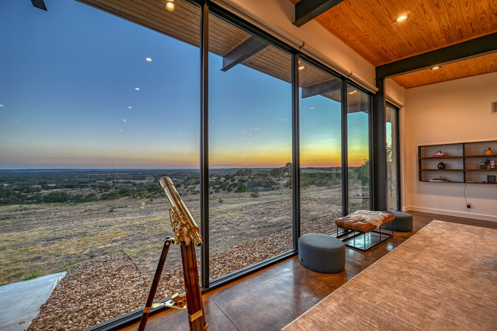 Experience the beauty of nature, featuring floor-to-ceiling windows that offer stunning views of the starry skies and gorgeous sunsets.